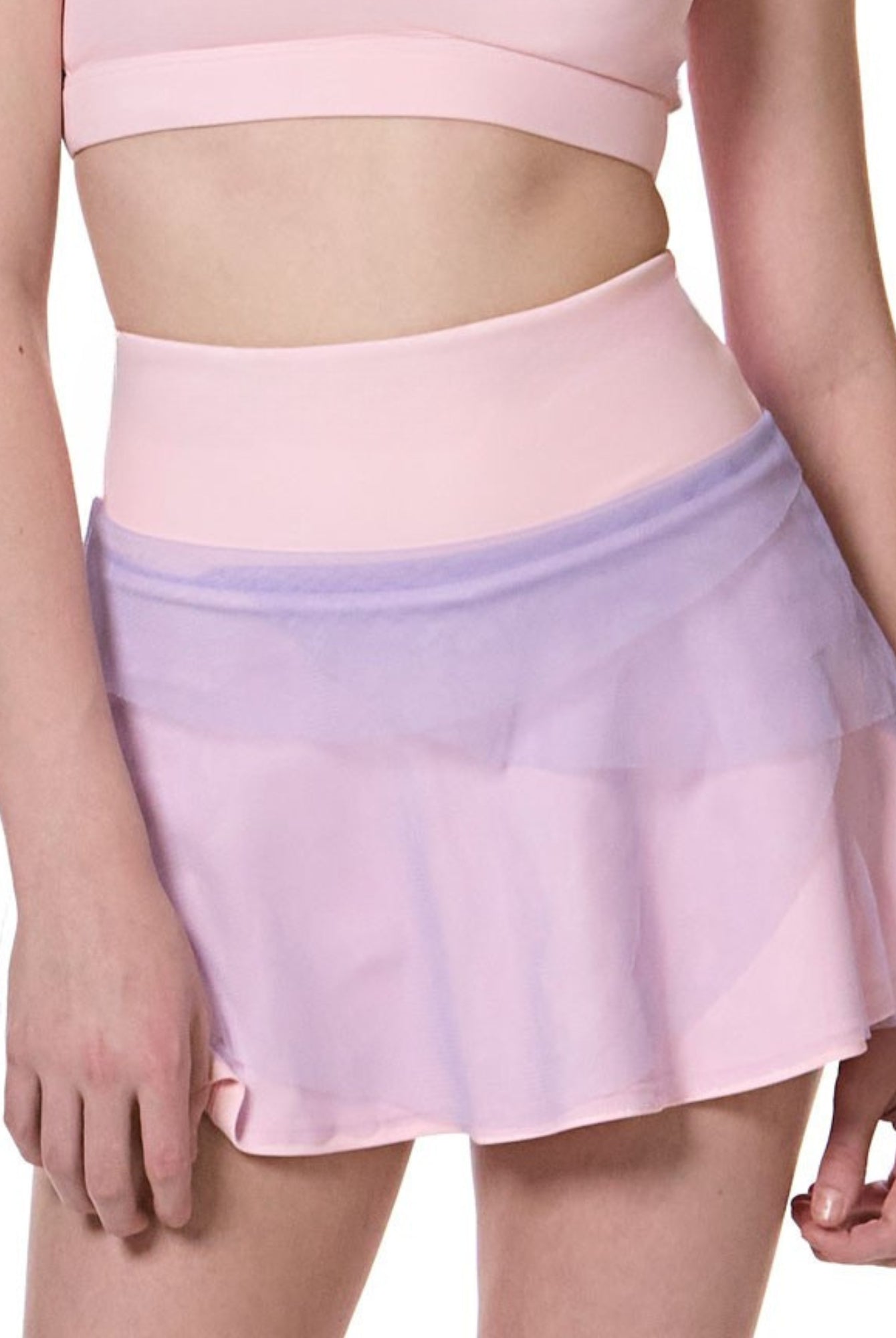 girl wearing pink and purple flare tennis skirt front view