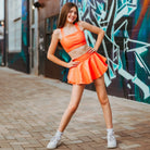 hot orange sports bra and orange skirt, tangerine crocodile print