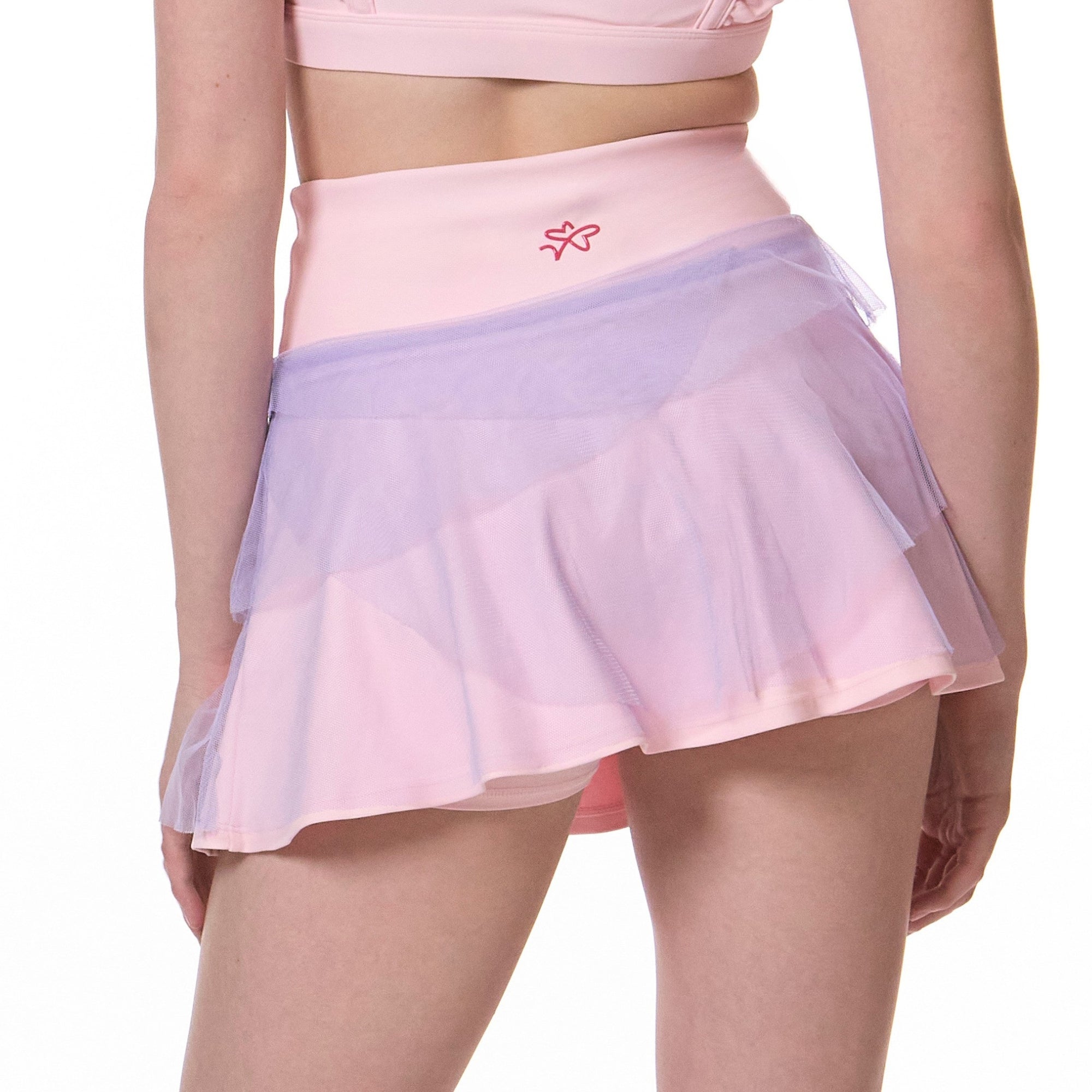 back view of flare tennis skirt showing movement and built-in shorts underneath