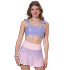 flare tennis skirt styled with metallic sports bra front view