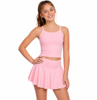 Girl wearing pink tennis outfit with En Pointe Tank and Classic Tennis Skirt